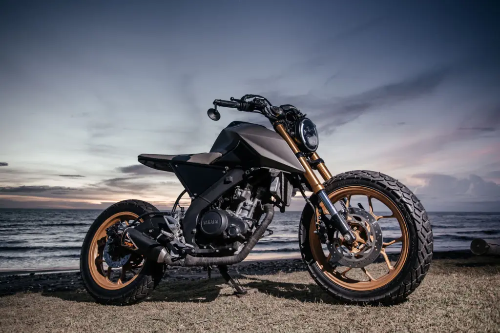 Custom Yamaha tracker on a Bali beach at sunset